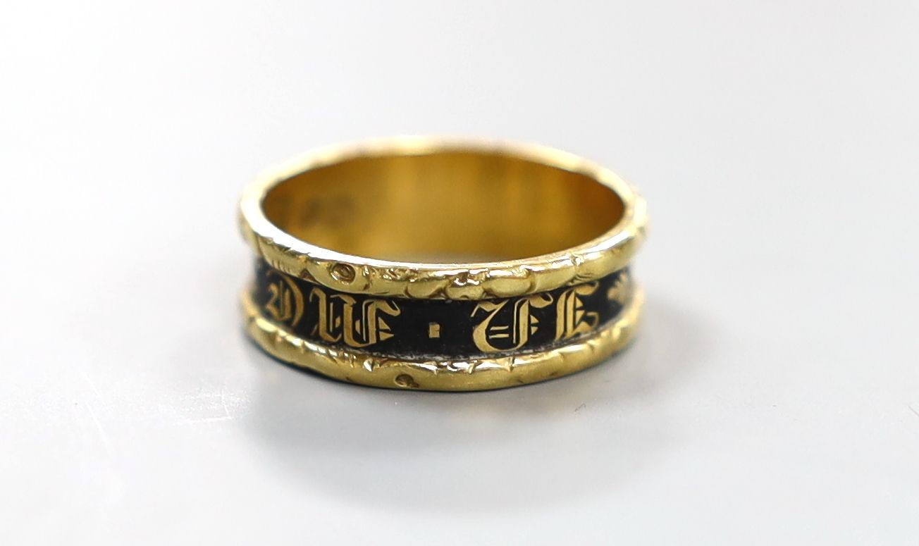 A late George IV 18ct gold and black enamel set mourning band, inscribed 'In Memory Of', shank hallmarked for Birmingham, 1829, size K/L, gross weight 3.2 grams.